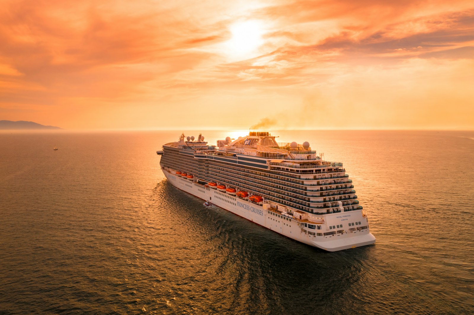 A cruise ship at sea — the kind of high-value, research-heavy trip Mark qualifies and prices on the call